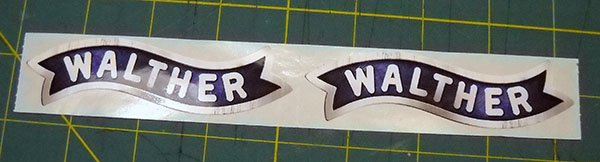 a pair of Walther-logo stickers still on their backing paper
